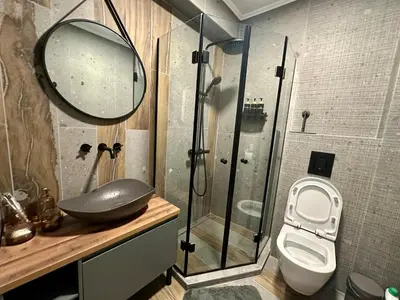 a bathroom with a shower and a sink and a toilet at Casa Nova with Free Garage Parking in Plovdiv