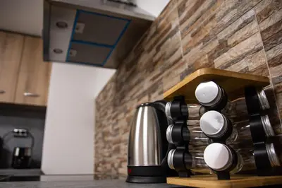 a coffee maker on a counter in a kitchen at Dzhorgovata Guesthouse in Govedartsi