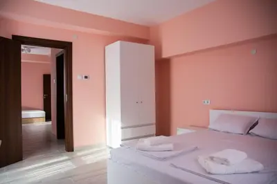 a bedroom with a bed with two towels on it at Dzhorgovata Guesthouse in Govedartsi