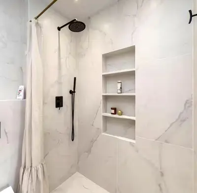 a bathroom with a shower with a shower curtain at Mattea's 2-bedroom apartment in Sofia