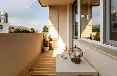 a balcony with a bench and a window at Mattea's 2-bedroom apartment in Sofia