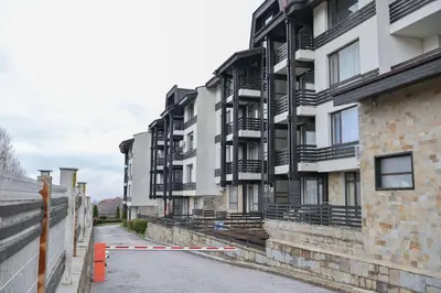 a row of apartment buildings on a street at Aspen Resort Studio Cozy & Fully Equipped by Flat Manаger in Bansko
