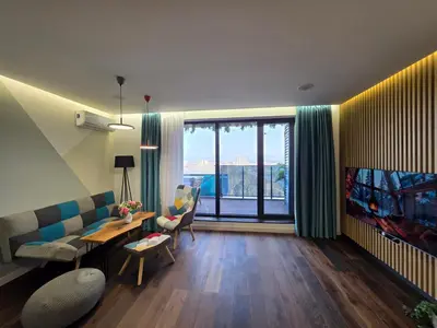 a living room with a couch and a table at ApArt by the river in Plovdiv