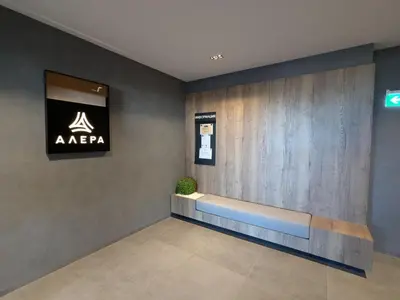 a waiting room with aania sign on the wall at Olive Urban Apartment, Free Parking in Sofia