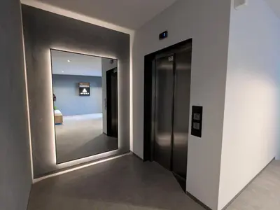 a hallway with a large mirror in a room at Olive Urban Apartment, Free Parking in Sofia