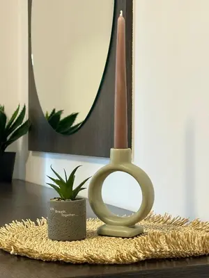 a candle holder on a table with a mirror at Ski Apartment Bansko Home2Host in Bansko