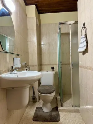 a bathroom with a toilet and a sink and a shower at Ski Apartment Bansko Home2Host in Bansko