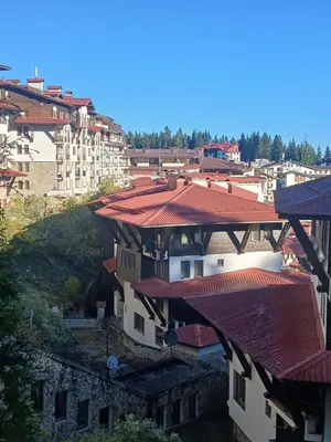 a group of buildings with red roofs at Grand Monastery apt Emo Pamporovo in Smolyan
