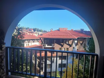 a view of a building from a balcony at Grand Monastery apt Emo Pamporovo in Smolyan