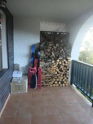 a room with a wall of fire wood at Grand Monastery apt Emo Pamporovo in Smolyan