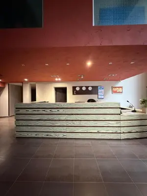 a lobby with a reception desk in a building at Chamkoria Borovets luxury apartment view in Borovets