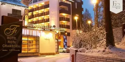 a hotel with a sign in front of a building at Chamkoria Borovets luxury apartment view in Borovets