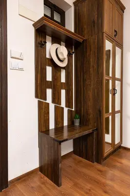 a hat sitting on a wooden bench in a room at Vacation Apartment in Starosel complex in Starosel