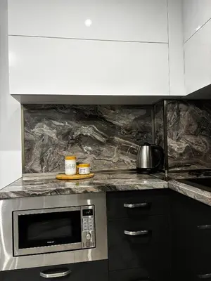 a kitchen with a counter top with a microwave at Thermal Bliss Apartment in Velingrad