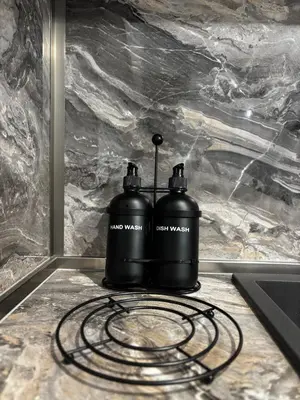 two water bottles sitting on top of a counter at Thermal Bliss Apartment in Velingrad