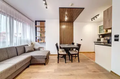 a living room with a couch and a table at Alpine Hideaway at The Castle in Smolyan