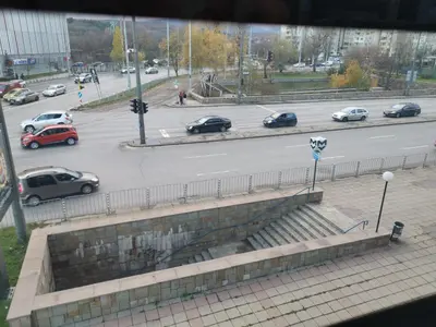 a view of a city street with cars on the road at West Park in Sofia
