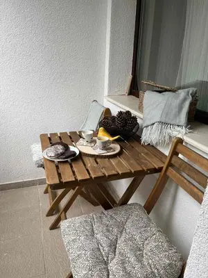 a wooden table with plates of food on it at RIA studio in Borovets Gardens hotel in Borovets