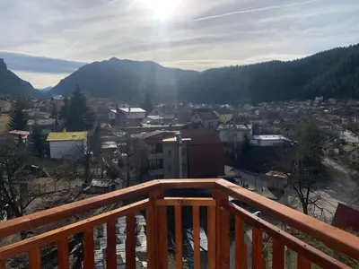 a view of a city from a wooden balcony at Rooftop apartment with stunning view in Beli Iskar