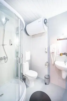 a bathroom with a shower and a toilet and a sink at 400m from Ski Belvedere Apartment - Free Parking - SPA in Bansko