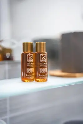 two bottles of essential oils sitting on a shelf at 400m from Ski lift Belvedere Apartment - SPA - Free parking in Bansko