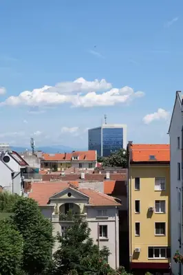 a view of a city with buildings and a skyscraper at Cozy 2BDR Balcony Apt with View in Historic Center in Sofia