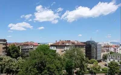 a view of a city with buildings and trees at Cozy 2BDR Balcony Apt with View in Historic Center in Sofia