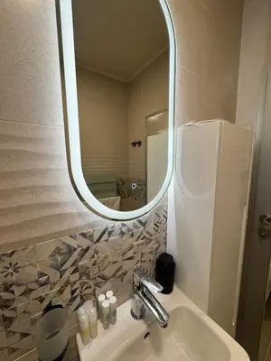 a bathroom with a sink and a mirror at Къща Камберови град Калофер in Kalofer