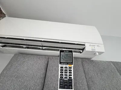 a remote control sitting on top of a bed at Plovdiv Moon - 1 Bedroom Luxury Apartment in Plovdiv