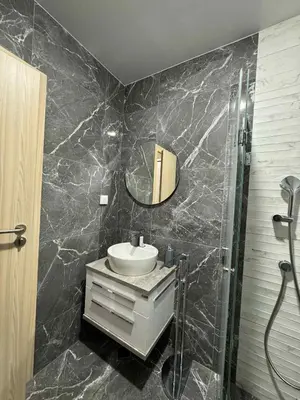 a bathroom with a sink and a mirror at Plovdiv Moon - 1 Bedroom Luxury Apartment in Plovdiv