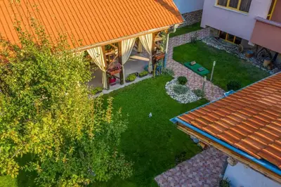 an overhead view of a backyard with an orange roof at Къща за гости Бумеранг in Velingrad