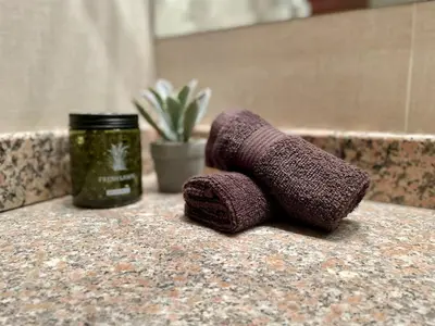 a purple roll of yarn sitting on a counter next to a jar at Cozy 1BR next to the Gondola by SI Stay in Bansko