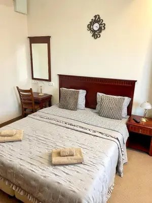 a bedroom with a large bed with two towels on it at Cozy 1BR next to the Gondola by SI Stay in Bansko