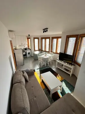 a living room with a couch and a table at Cu29 Kapana art Apartments in Plovdiv