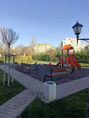 a park with several benches and a playground at Boutique apartment 4-6 in Plovdiv