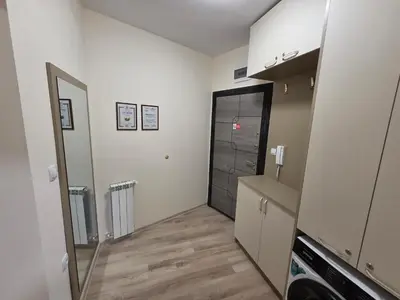 a kitchen with a mirror and a door in a room at Apartment Aria 7 in Velingrad
