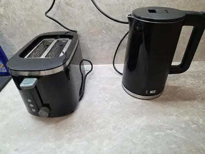 a black coffee maker sitting on top of a counter at Apartment Aria 7 in Velingrad