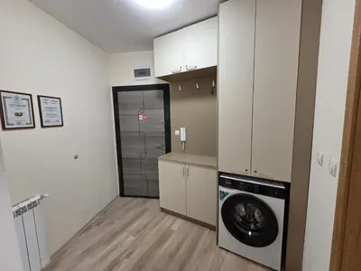 a small kitchen with a washer and dryer at Apartment Aria 7 in Velingrad