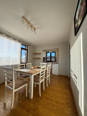 a kitchen and dining room with a table and chairs at Къща за гости Пегас in Velingrad