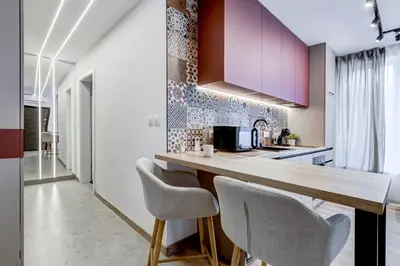 a kitchen with purple cabinets and white chairs at Newly Renovated Comfortable First-Floor Stay in Sofia