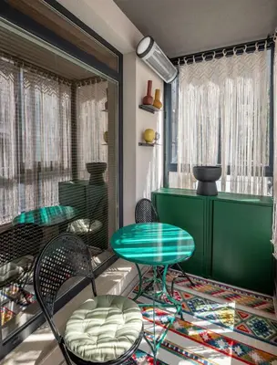 a room with chairs and a table and a window at Plovdiv ArtNest - 1-Bedroom Cozy Apartments in Plovdiv