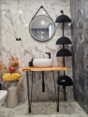 a bathroom with a sink and a mirror at By The Pool Apartments #7 in Velingrad