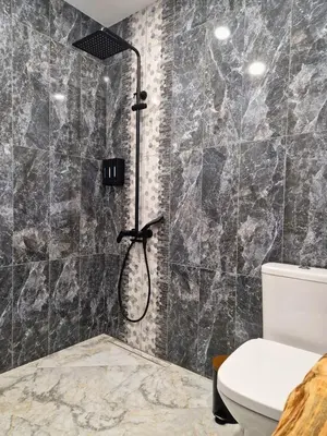 a bathroom with a shower with a toilet at By The Pool Apartments #7 in Velingrad