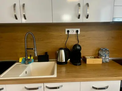 a kitchen counter with a sink and a mixer at Raya - Apartmant in Plovdiv, with private parking in Plovdiv
