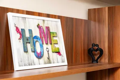 a wooden shelf with a picture of the word love at Convenient Studio with great view over Plovdiv in Plovdiv