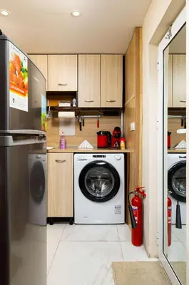 a kitchen with a washing machine and a refrigerator at Convenient Studio with great view over Plovdiv in Plovdiv