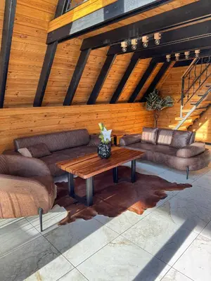 a living room with a couch and a table at Camping Between the Mountains Bansko in Bansko