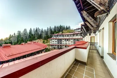 a view from the balcony of a building at Two-bedroom Apartment in the Heart of the Rhodopes in Pamporovo