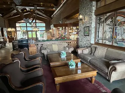 a living room with couches and a coffee table at PIRIN GOLF DELUXE PRIVATE STUDIO GABBY ground floor in Bansko