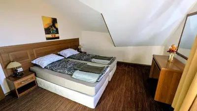 a bedroom with a bed in a room at Mountain view apartment at Emerald Hotel in Bansko